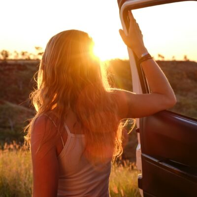 woman holding vehicle door